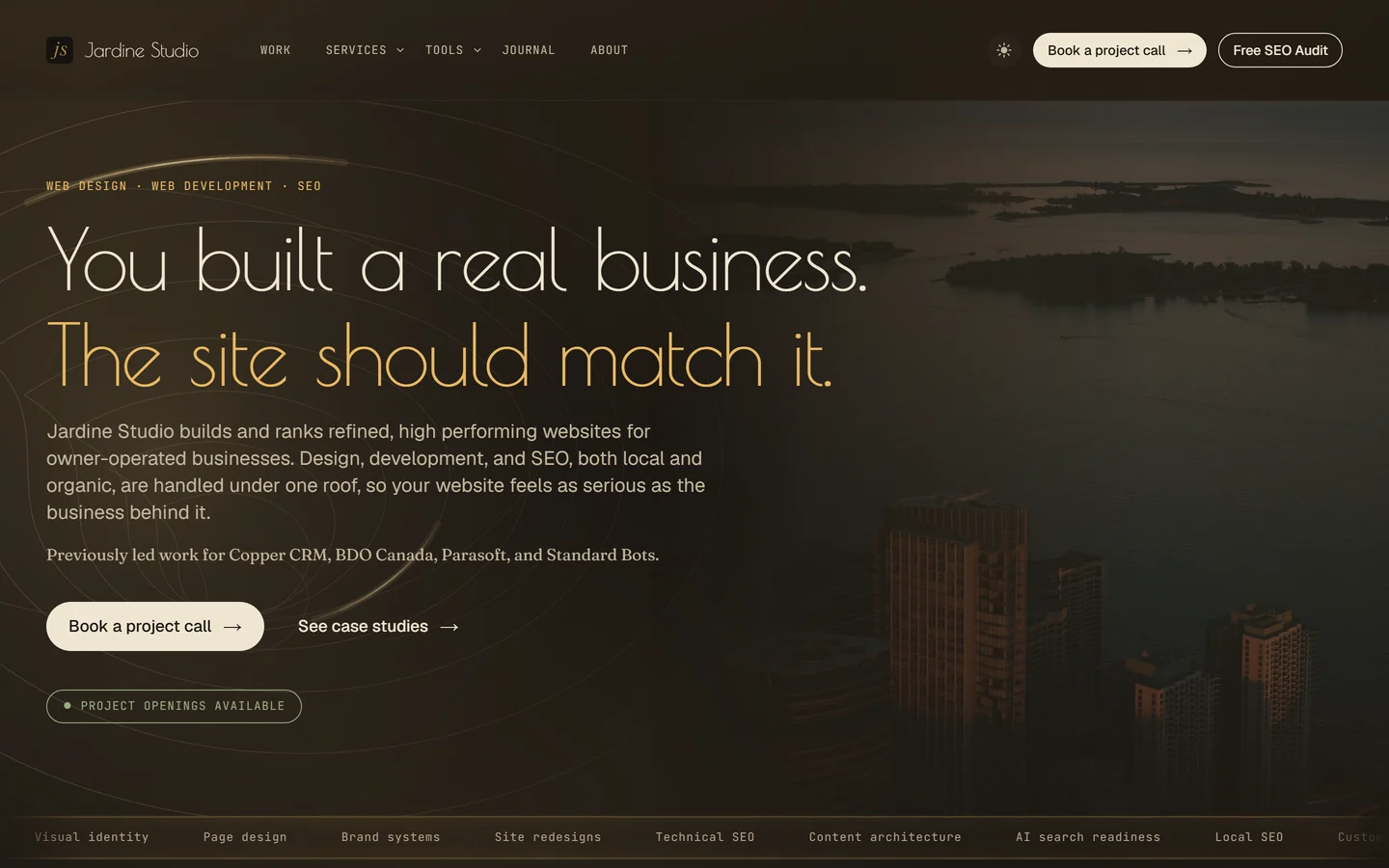 Earlier homepage with a photographed city waterfront and the headline You built a real business.